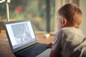 a child watches computer